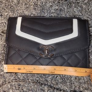 Black and white trim side bag